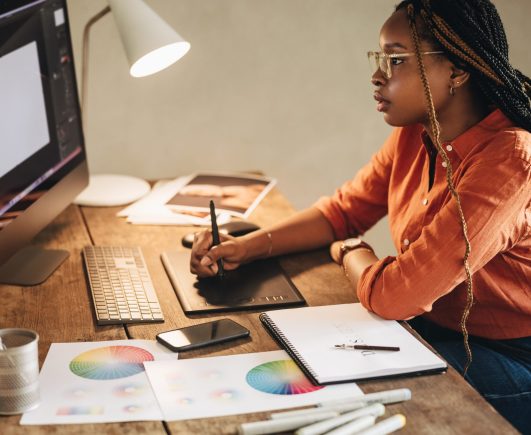 Female,Graphic,Designer,Working,At,Her,Desk